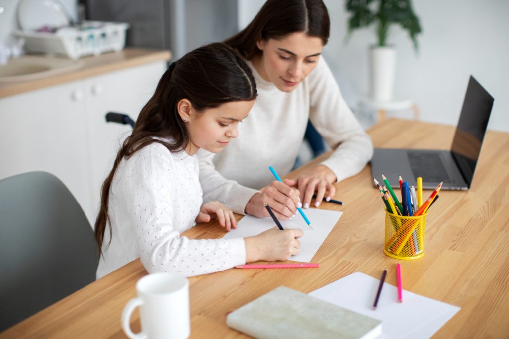 A tutor working one-to-one with a student online